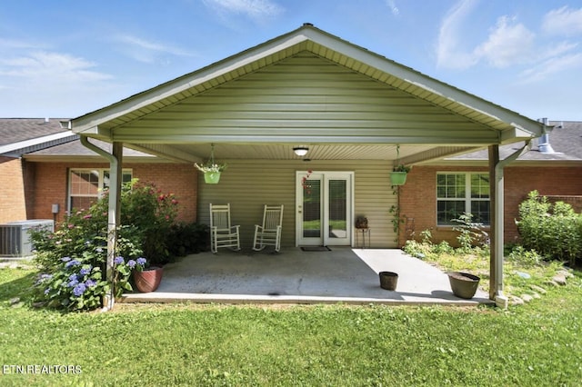 153 Creed Way, New Tazewell, TN 37825 - back of property featuring brick siding, a patio area, and a yard