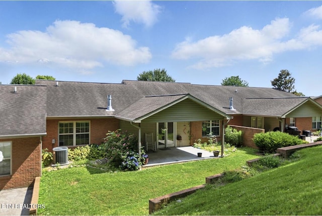 153 Creed Way, New Tazewell, TN 37825 - rear view of property featuring brick siding, a patio area, a yard, and a shingled roof