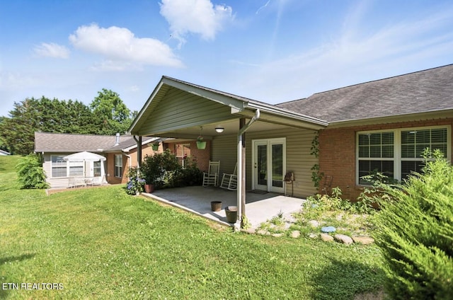 153 Creed Way, New Tazewell, TN 37825 - rear view of house featuring a patio, a lawn, brick siding, and roof with shingles