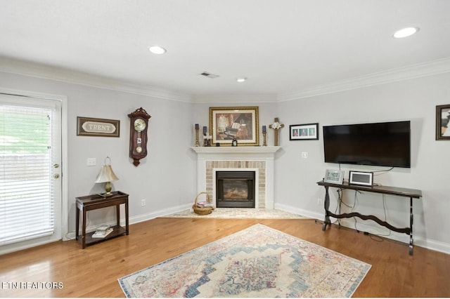 153 Creed Way, New Tazewell, TN 37825 - living area featuring ornamental molding, wood finished floors, a brick fireplace, and recessed lighting