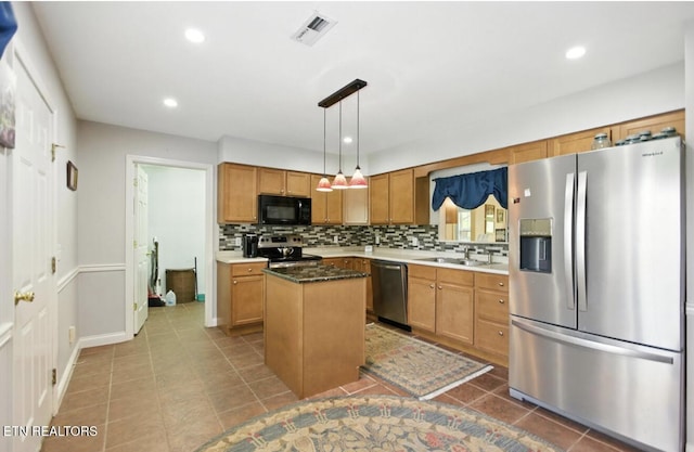 153 Creed Way, New Tazewell, TN 37825 - kitchen featuring appliances with stainless steel finishes, a center island, decorative backsplash, tile patterned floors, and recessed lighting