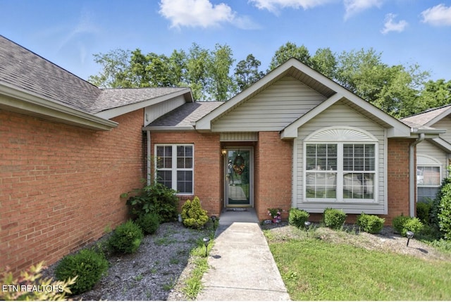 153 Creed Way, New Tazewell, TN 37825 - doorway to property with brick siding and a shingled roof