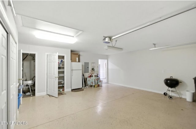 153 Creed Way, New Tazewell, TN 37825 - garage with freestanding refrigerator, electric panel, and a garage door opener