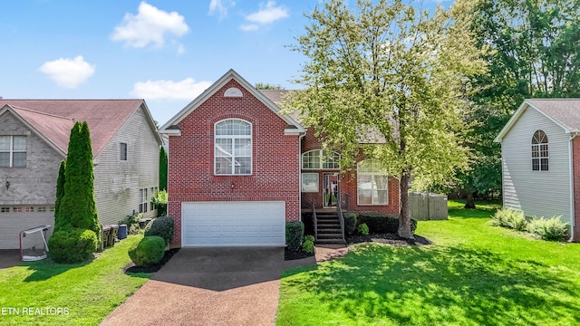 1213 Vale View Rd, Knoxville, TN 37922 - view of front of property featuring brick siding, concrete driveway, an attached garage, and a front yard