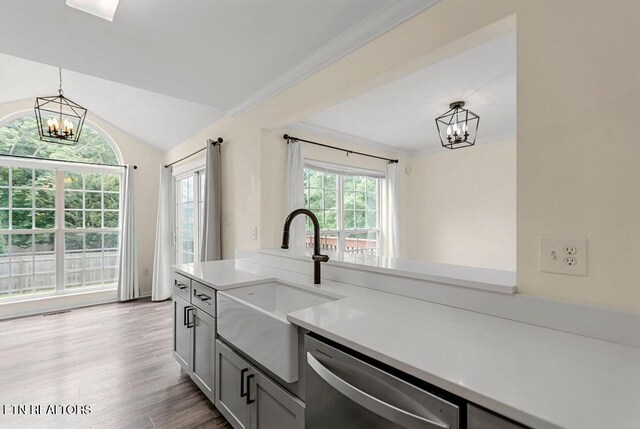 1213 Vale View Rd, Knoxville, TN 37922 - kitchen with a chandelier, dishwasher, a sink, light countertops, and pendant lighting