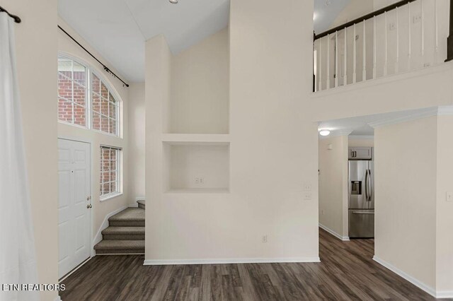 1213 Vale View Rd, Knoxville, TN 37922 - entryway featuring high vaulted ceiling, baseboards, dark wood-style flooring, and stairway