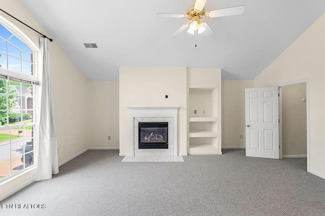 1213 Vale View Rd, Knoxville, TN 37922 - unfurnished living room featuring lofted ceiling, carpet floors, baseboards, a high end fireplace, and a ceiling fan