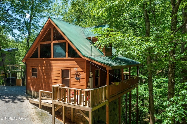 2261 Beach Front Dr, Sevierville, TN 37876 - rear view of house featuring a wooden deck and metal roof