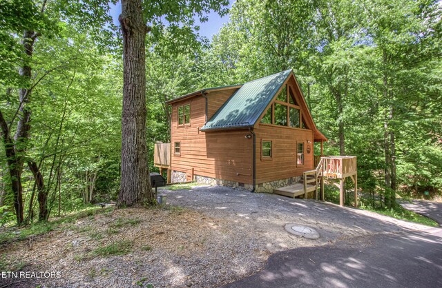 2261 Beach Front Dr, Sevierville, TN 37876 - view of side of property featuring metal roof and a wooden deck