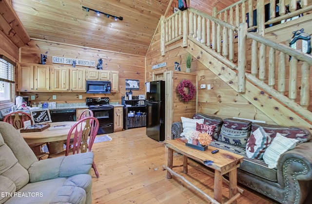 2261 Beach Front Dr, Sevierville, TN 37876 - living room with vaulted ceiling, wood walls, light wood-type flooring, and wood ceiling