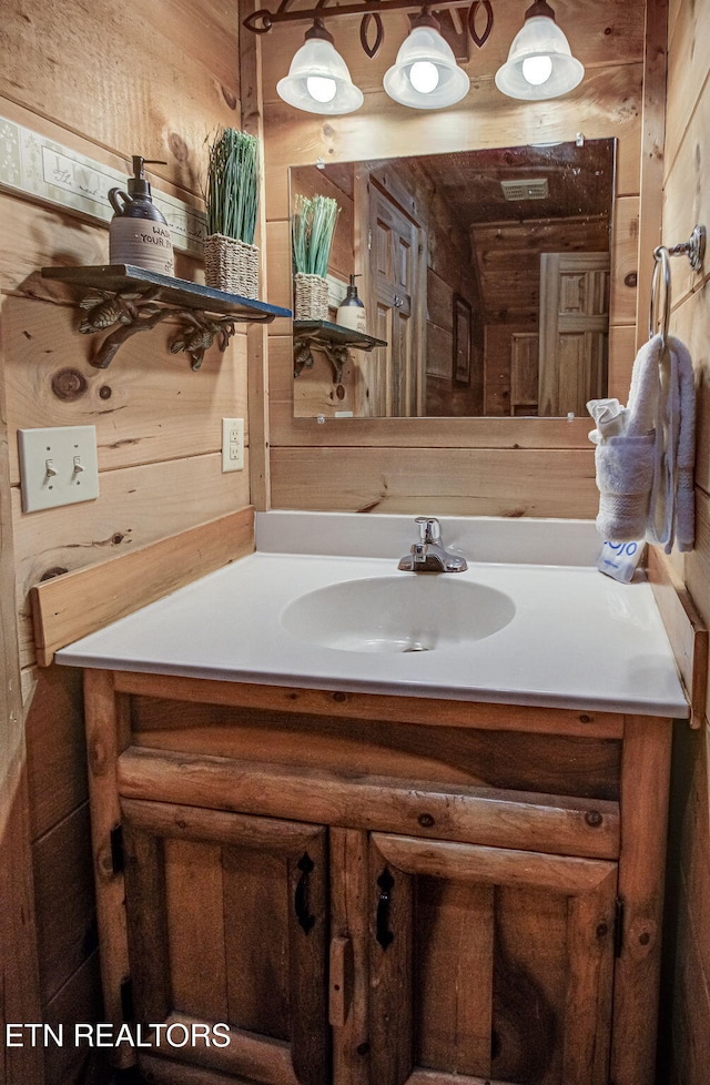 2261 Beach Front Dr, Sevierville, TN 37876 - bathroom with vanity and wooden walls