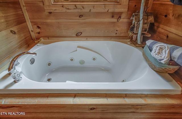 2261 Beach Front Dr, Sevierville, TN 37876 - full bath featuring a tub with jets and wooden walls