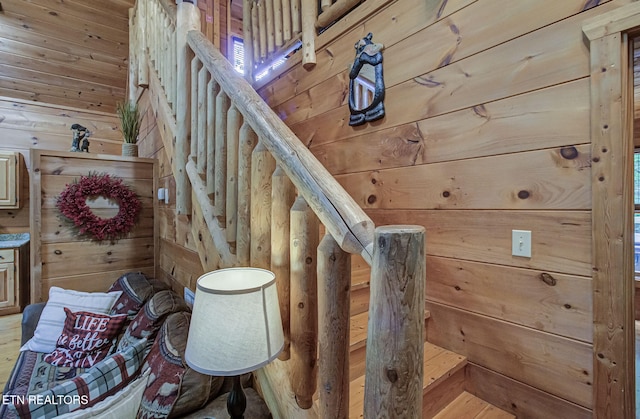 2261 Beach Front Dr, Sevierville, TN 37876 - stairs featuring wood walls and wood finished floors