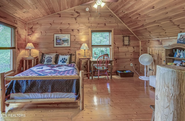 2261 Beach Front Dr, Sevierville, TN 37876 - bedroom with vaulted ceiling, wooden ceiling, wood-type flooring, and wooden walls