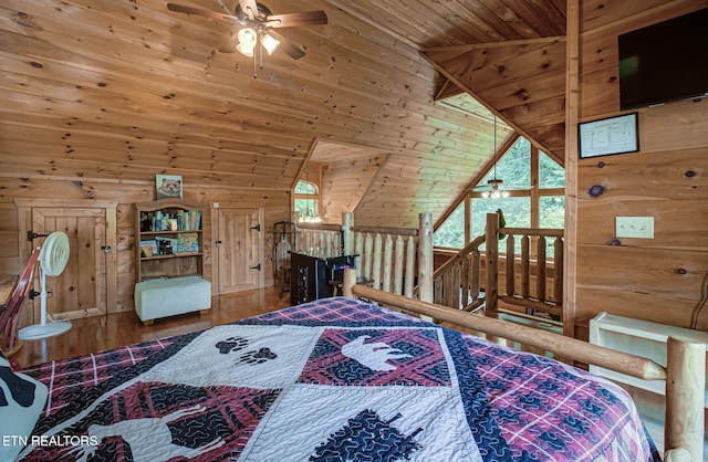 2261 Beach Front Dr, Sevierville, TN 37876 - bedroom featuring wooden walls, wooden ceiling, lofted ceiling, and wood finished floors