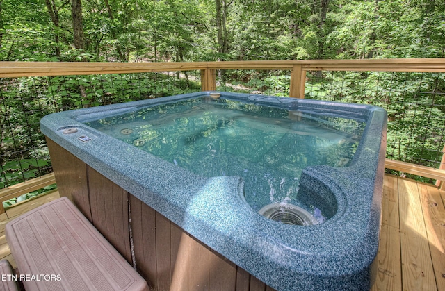 2261 Beach Front Dr, Sevierville, TN 37876 - view of pool with a hot tub, a wooden deck, and a wooded view