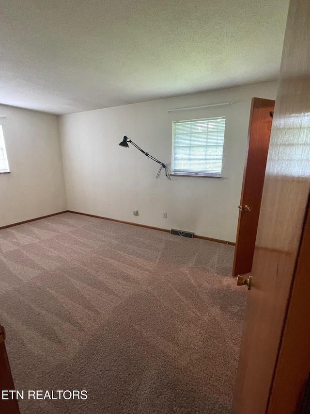 217 Newport Rd Unit 5, Knoxville, TN 37934 - carpeted spare room featuring a textured ceiling and baseboards