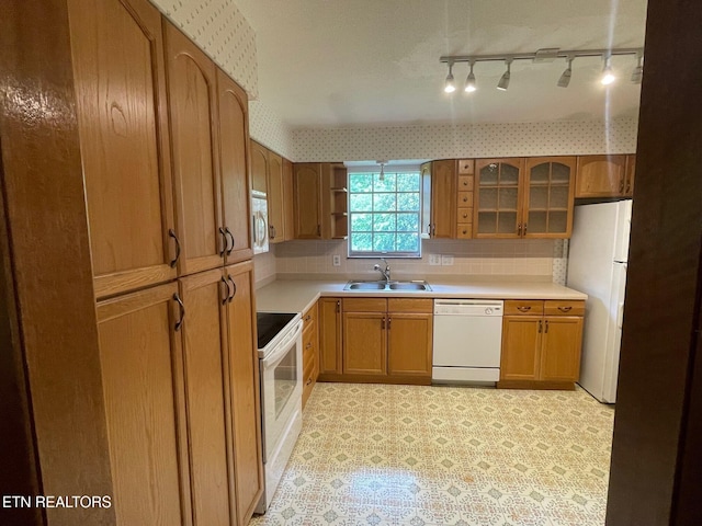 217 Newport Rd Unit 5, Knoxville, TN 37934 - kitchen with white appliances, a sink, glass insert cabinets, brown cabinetry, and open shelves