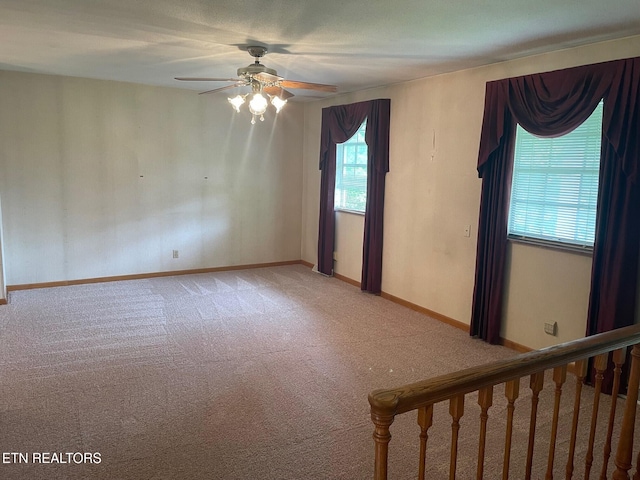 217 Newport Rd Unit 5, Knoxville, TN 37934 - unfurnished room featuring light colored carpet, a ceiling fan, baseboards, and stairway