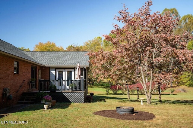 236 Stratford Dr, Cookeville, TN 38506 - view of green lawn with a wooden deck and a fire pit