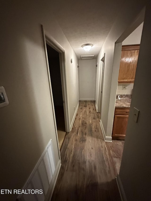 105 Mudlick Rd, Middlesboro, KY 40965 - hall featuring dark wood finished floors and baseboards
