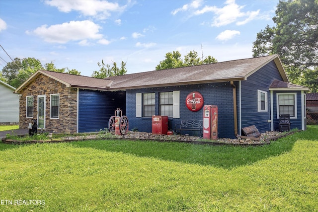 2837 Willa View Dr, Pigeon Forge, TN 37863 - view of front of house featuring a front yard, brick siding, and stone siding