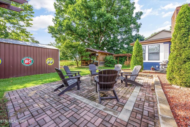 2837 Willa View Dr, Pigeon Forge, TN 37863 - view of patio / terrace featuring a fire pit and an outbuilding