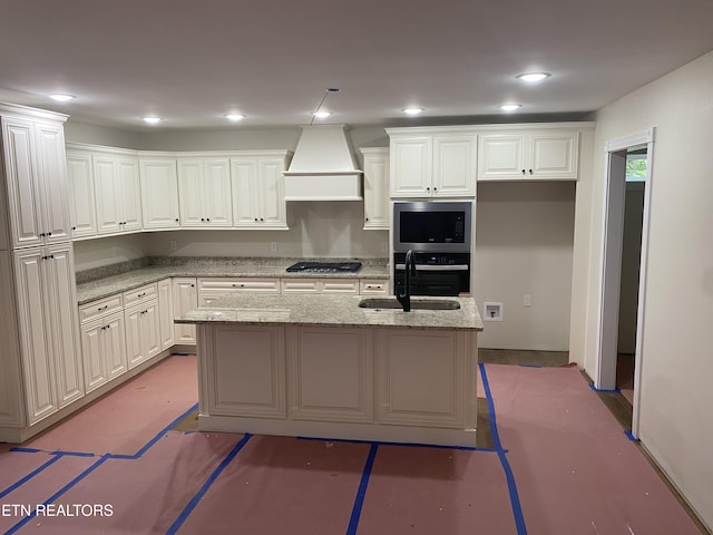 233 Albemarle Cir, Fairfield Glade, TN 38558 - kitchen with custom exhaust hood, stainless steel appliances, white cabinets, an island with sink, and recessed lighting