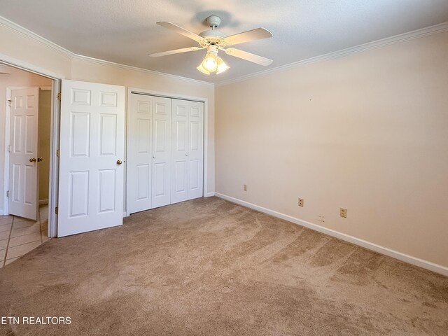 11104 Joiner Way, Knoxville, TN 37934 - unfurnished bedroom with carpet, ornamental molding, baseboards, a closet, and a ceiling fan