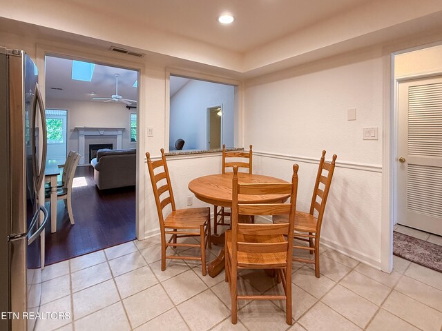 11104 Joiner Way, Knoxville, TN 37934 - dining room featuring a ceiling fan, a fireplace, light tile patterned flooring, and recessed lighting
