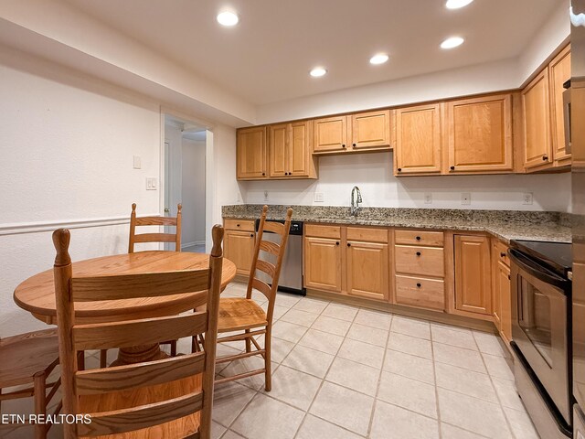 11104 Joiner Way, Knoxville, TN 37934 - kitchen with stainless steel appliances, recessed lighting, a sink, dark stone countertops, and light tile patterned floors