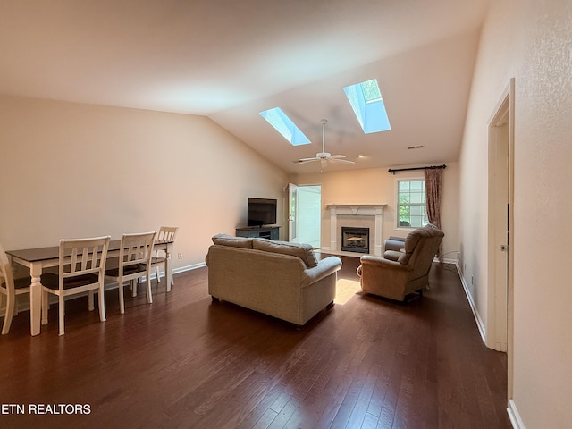 11104 Joiner Way, Knoxville, TN 37934 - living area featuring a skylight, dark wood-type flooring, a tiled fireplace, vaulted ceiling, and baseboards