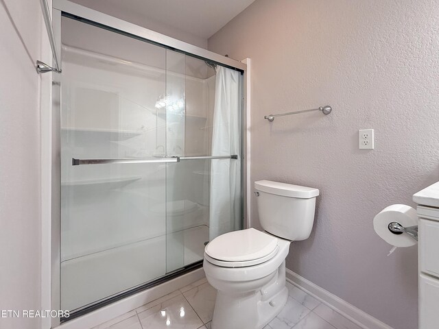 11104 Joiner Way, Knoxville, TN 37934 - full bath with toilet, marble look tile flooring, vanity, baseboards, and a stall shower
