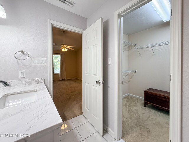 11104 Joiner Way, Knoxville, TN 37934 - washroom with light carpet, baseboards, ceiling fan, and light marble finish flooring