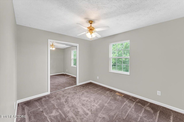 1413 Farrington Dr Unit 1, Knoxville, TN 37923 - empty room featuring a ceiling fan, carpet, baseboards, and a textured ceiling