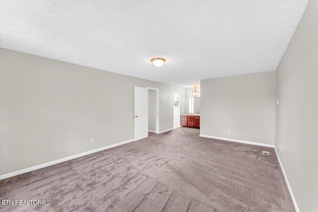 1413 Farrington Dr Unit 1, Knoxville, TN 37923 - carpeted empty room featuring baseboards and a textured ceiling