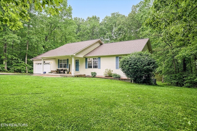 2236 Spruce Loop, Crossville, TN 38555 - ranch-style house with an attached garage, a front yard, roof with shingles, and covered porch