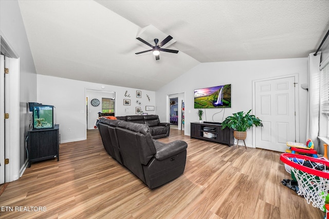 2236 Spruce Loop, Crossville, TN 38555 - living area featuring ceiling fan, lofted ceiling, light wood finished floors, and baseboards