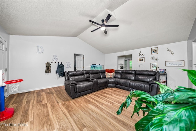 2236 Spruce Loop, Crossville, TN 38555 - living area featuring a ceiling fan, wood finished floors, lofted ceiling, a textured ceiling, and baseboards