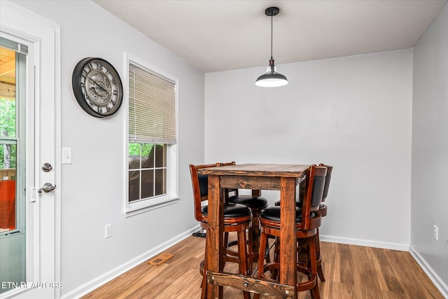 2236 Spruce Loop, Crossville, TN 38555 - dining area with wood finished floors, baseboards, and a textured ceiling