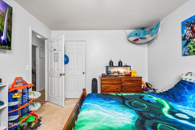 2236 Spruce Loop, Crossville, TN 38555 - bedroom with a textured ceiling and carpet flooring