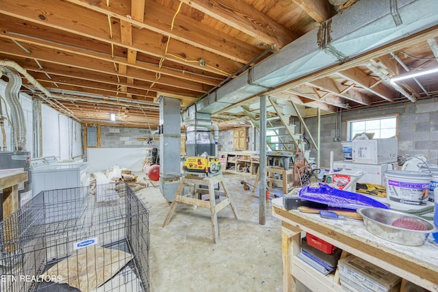 112 Carter Dr, Loudon, TN 37774 - below grade area featuring independent washer and dryer and a workshop area