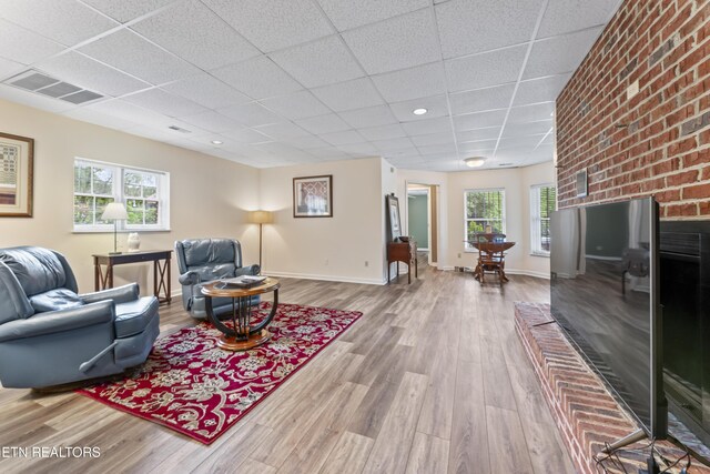 827 Knight Bridge Rd, Maryville, TN 37803 - living area with a drop ceiling, wood finished floors, and baseboards