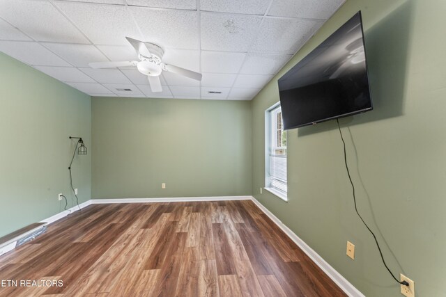 827 Knight Bridge Rd, Maryville, TN 37803 - empty room with a drop ceiling, wood finished floors, ceiling fan, and baseboards