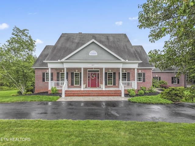 827 Knight Bridge Rd, Maryville, TN 37803 - greek revival inspired property featuring brick siding, a porch, a front yard, and roof with shingles