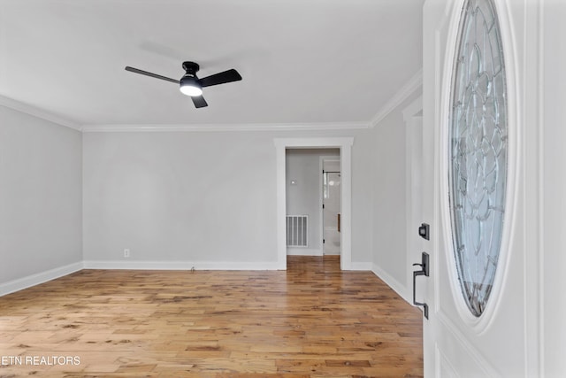 207 N Laurel Cir, Knoxville, TN 37912 - spare room featuring crown molding, a ceiling fan, wood finished floors, and baseboards