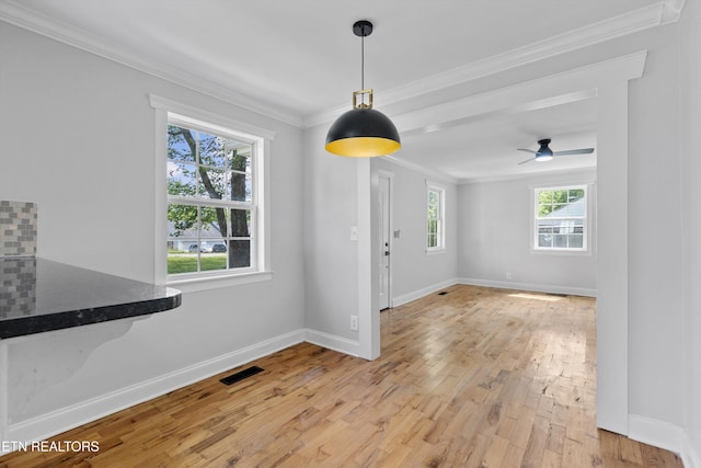 207 N Laurel Cir, Knoxville, TN 37912 - unfurnished dining area featuring ornamental molding, light wood finished floors, baseboards, and ceiling fan