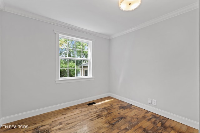 207 N Laurel Cir, Knoxville, TN 37912 - spare room featuring baseboards, crown molding, and hardwood / wood-style flooring