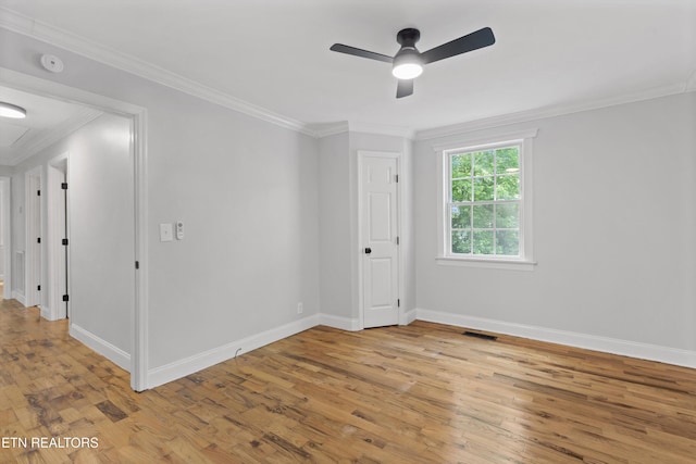 207 N Laurel Cir, Knoxville, TN 37912 - empty room with ceiling fan, light wood-type flooring, crown molding, baseboards, and a smoke detector