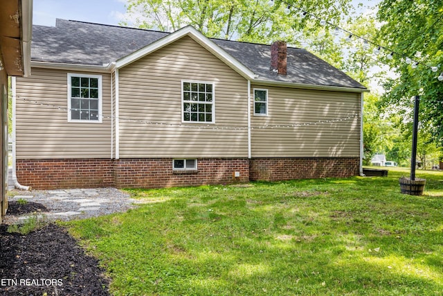 207 N Laurel Cir, Knoxville, TN 37912 - view of home's exterior with a lawn, a shingled roof, and a chimney